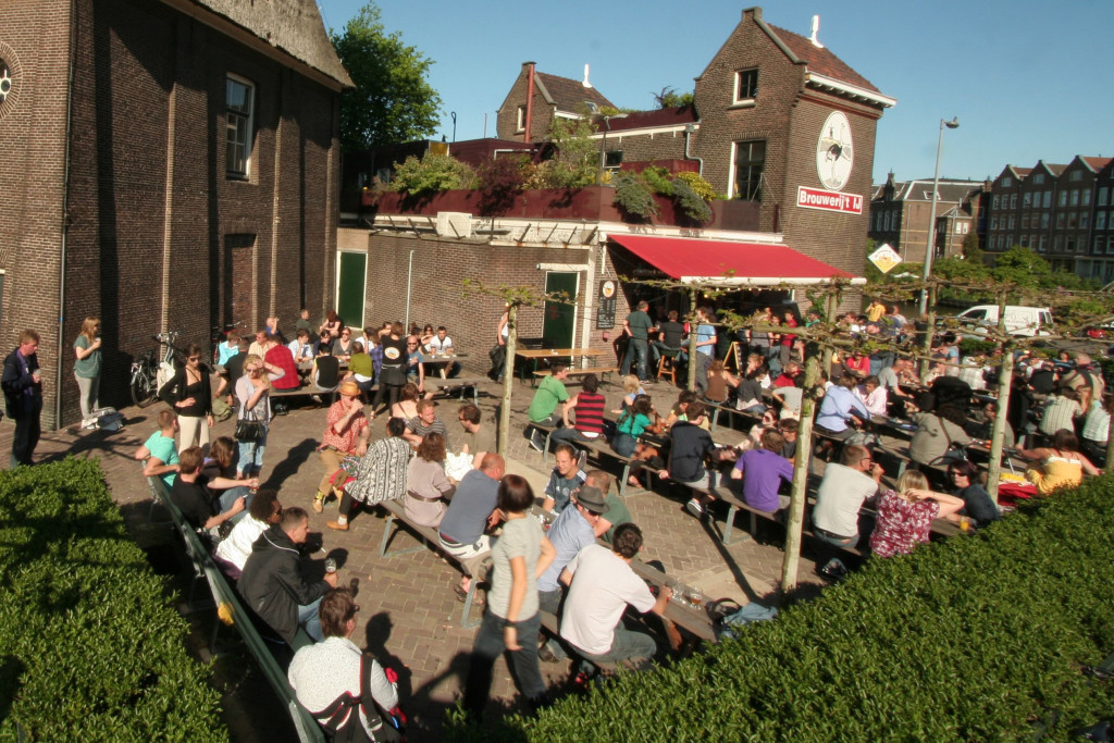 Picture of people having beers outside T'IJ brewery in Amsterdam