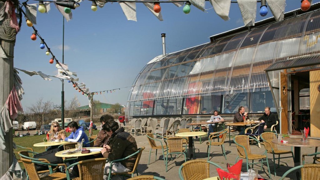 View of the outside of the bar coffee tables and customers