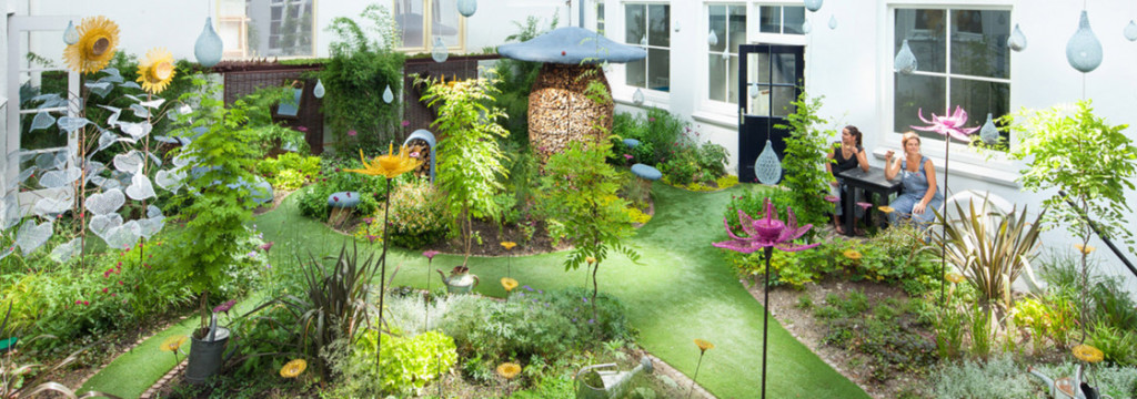 The peaceful grass and sculpture area of a design store